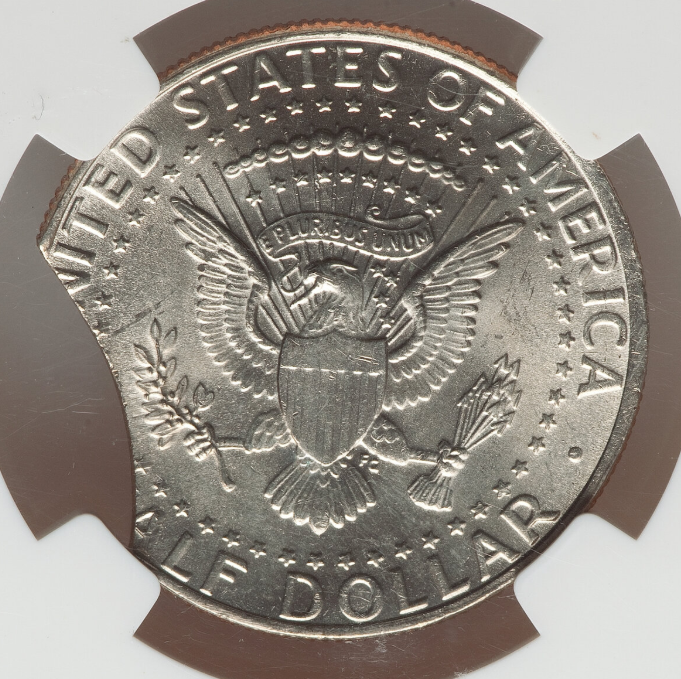 2022 Kennedy half dollar clipped planchet error showing curved missing section at the coin edge